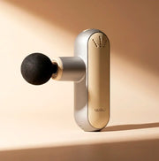 HAZUMI LIGHT ultra-compact percussion massager with ergonomic design for muscle recovery.