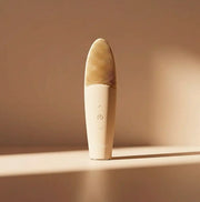 EMI NUDE Facial Cleansing Brush and Massager on a soft background with buttons for easy use.