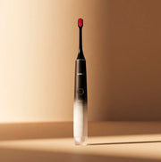 MORI BLACK NEW - SONIC TOOTHBRUSH with sleek black and red design, showcasing its modern features for effective teeth cleaning.